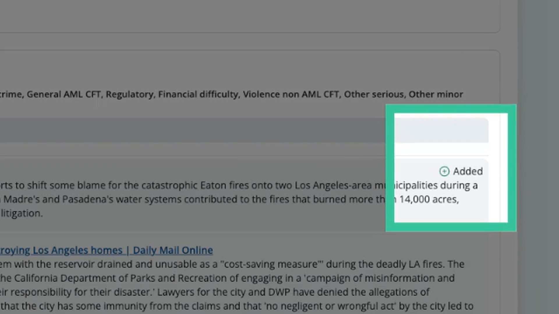 A close-up of the Added icon next to a new adverse media entry